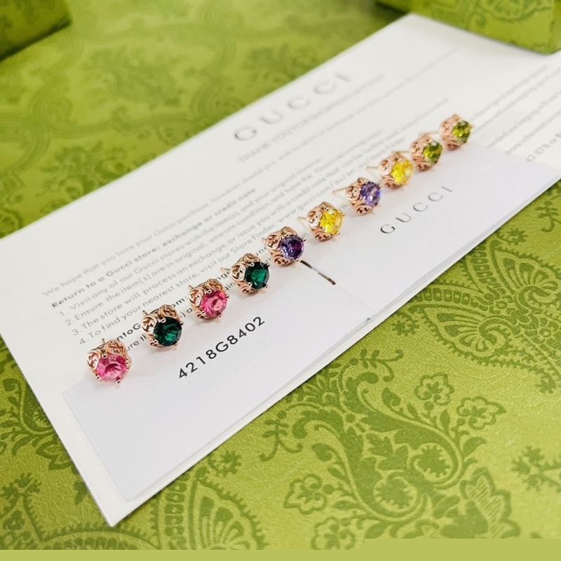 G*u*i earrings